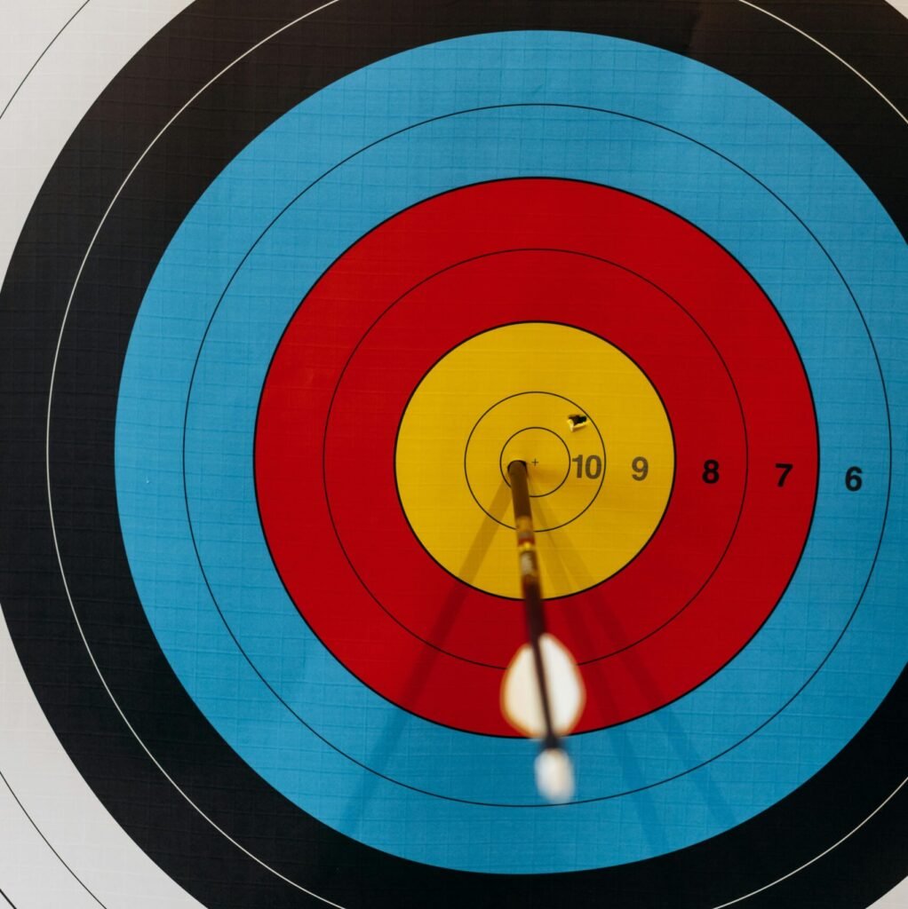 a bullseye with an arrow in the middle